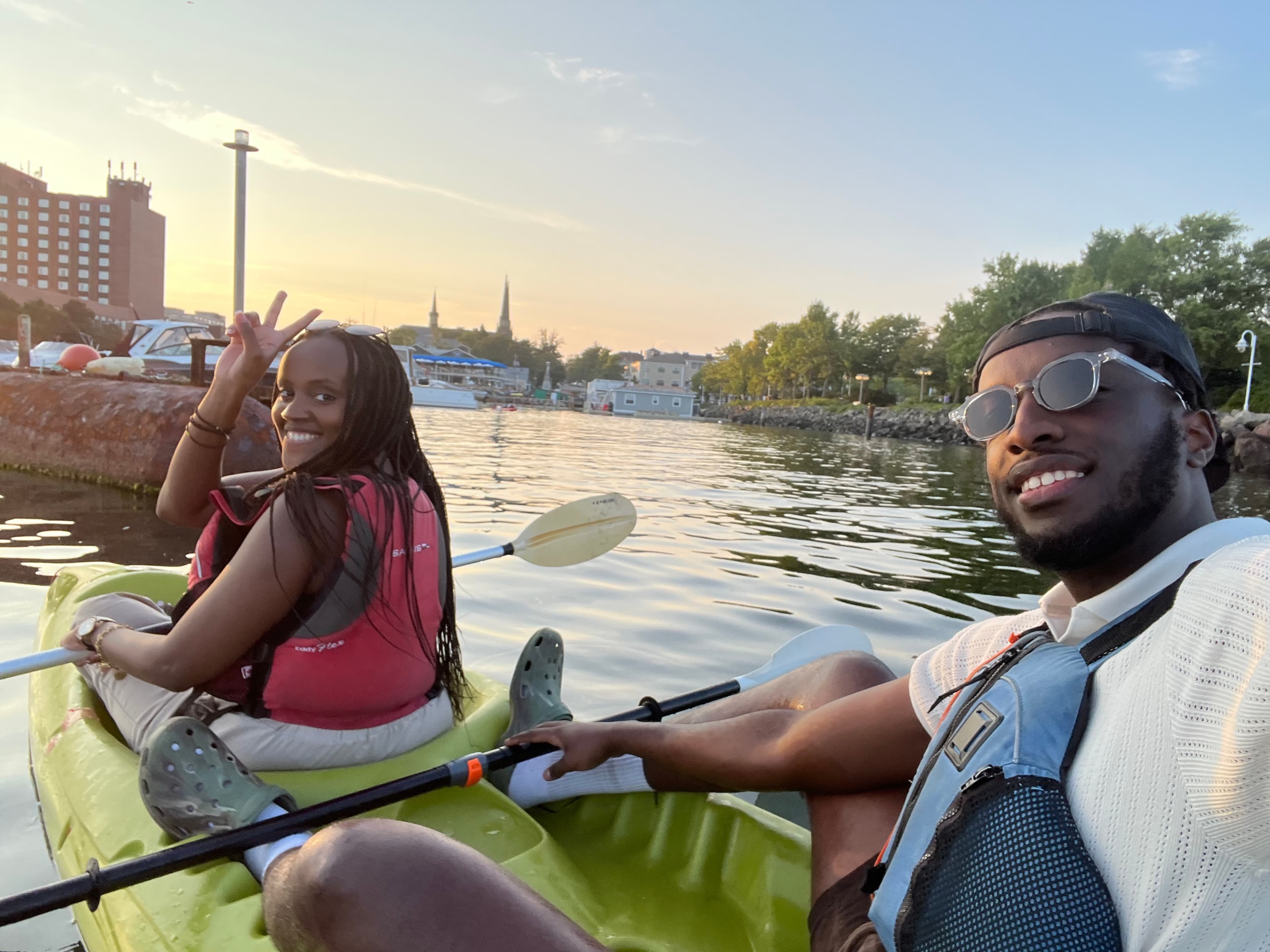 Joshua and Sandrine kayaking together at sunset